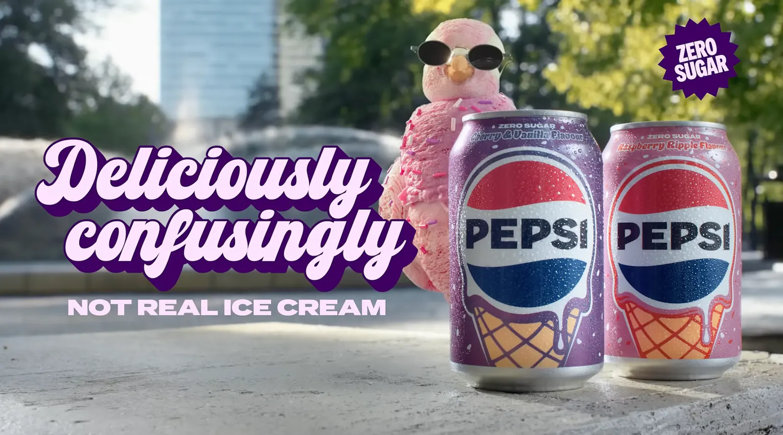 Pidge, Pepsi’s raspberry-pink pigeon mascot, standing behind two ice-cream-inspired Pepsi Zero Sugar cans
